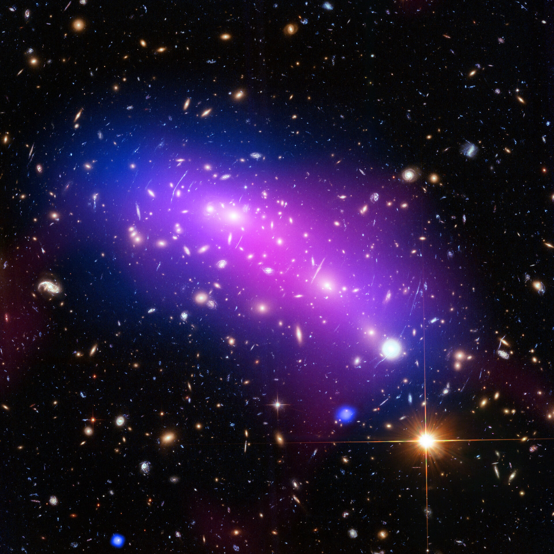 Composite image created by three telescopes (Hubble Space Telescope, NASA Chandra X-ray Observatory and NRAO Jansky Very Large Array radio telescope, of two colliding galaxy clusters, coming together to make one great cluster. 