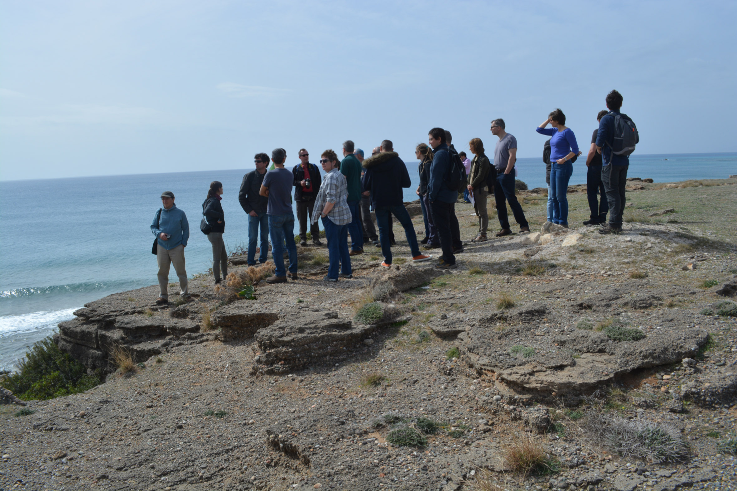 FLOWS delegates examine beach rocks on Crete’s southern shore which were uplifted by the action of past earthquakes. Photo: Adriano Mazzini
