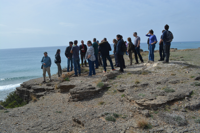 FLOWS delegates examine beach rocks on Crete’s southern shore which were uplifted by the action of past earthquakes. Photo: Adriano Mazzini