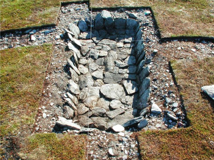 Image of an excavated slablined pit at Mellaneset, Berlevåg