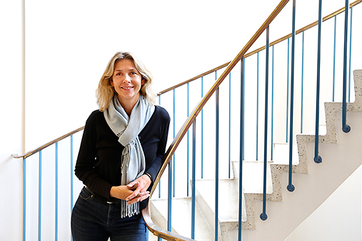 Hedvig Nordeng smiling in front of stairs