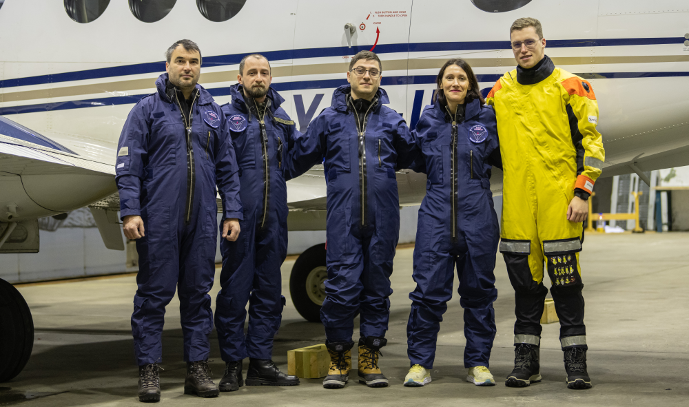 Photo Andøya, Northern Norway: The crew of two pilots and two operators from INCAS/Romania (link), and Professor Trude Storelvmo, University of Oslo as number four from left. The picture is from Hangar B, Andøya Flystasjon before a research-flight in February 2023 in conjunction with the MC2 project. Photo: Private