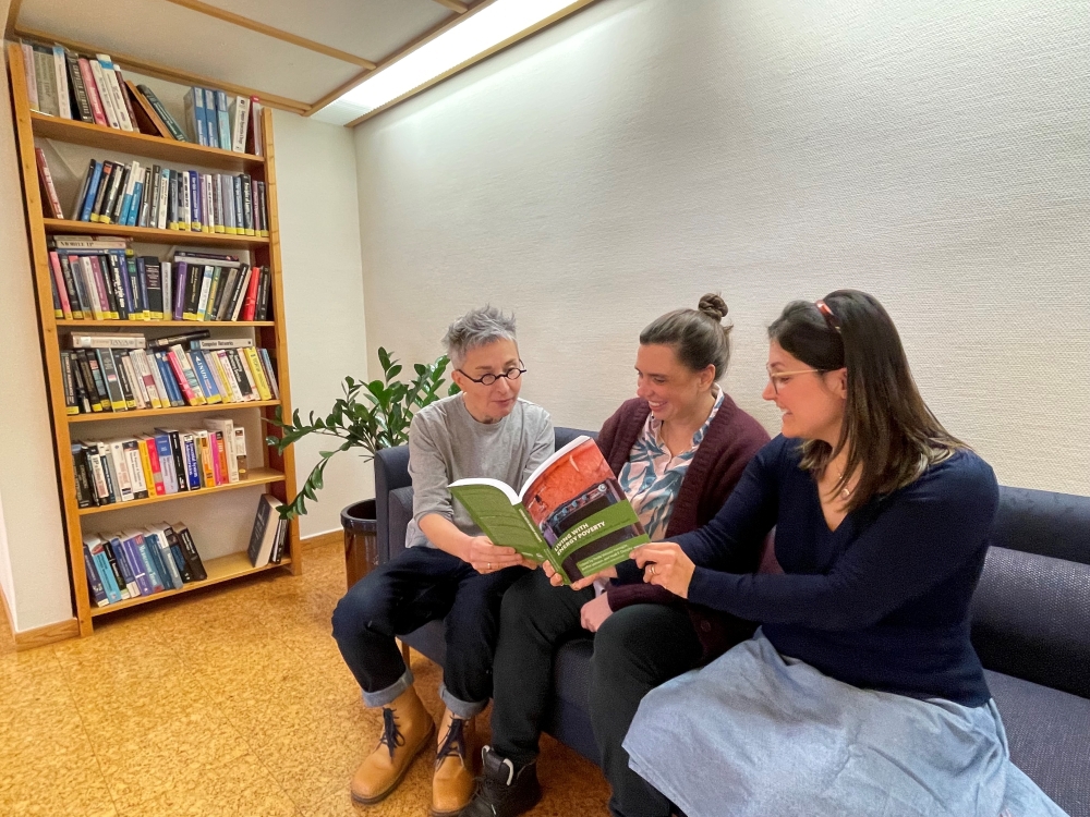 Deputy Head of Education: Matylda N.Guzik, Postdoctoral Fellow at the Section for Energy Systems, Paola Velasco Herrejón and Head of Research, Marianne Zeyringer at UiO, Kjeller reading a book