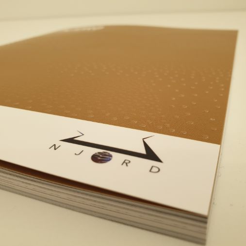 Close-up of Njord-logo on a booklet.